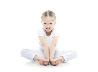 small and very beautiful girl engaged in yoga