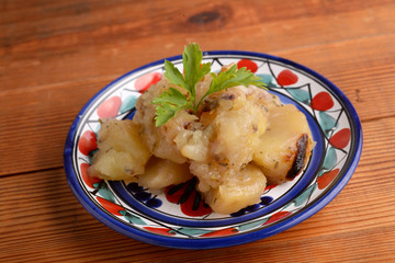 Baked potatoes with onion
