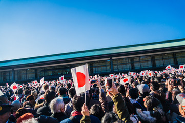 People holding Japanese flag in hand