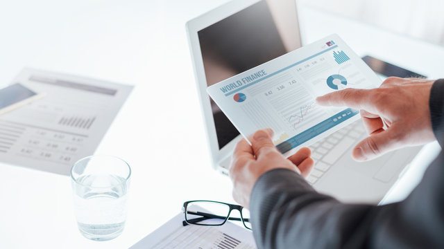 Businessmen using a touch screen device