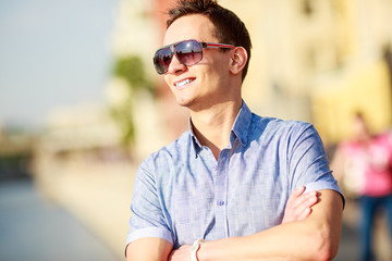 Portrait of a handsome young man with sunglasses