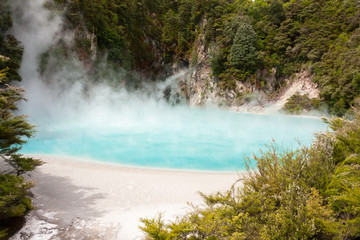 Crater lake, blue (turquoise) hot smoking water.