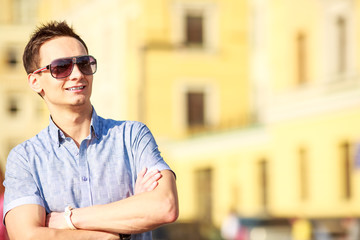 Portrait of a handsome young man with sunglasses