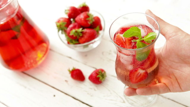 Fresh strawberry with cooling homemade lemonade on the wooden table