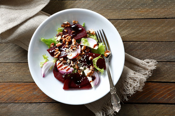 Salad with beetroot and walnuts on a plate