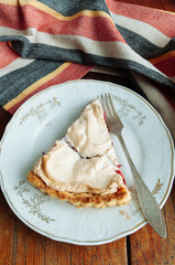 Cranberries meringue tart on the plate