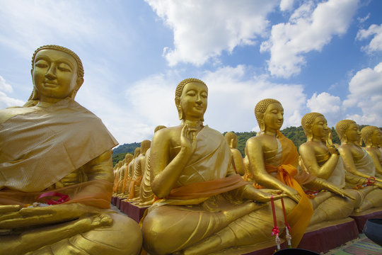 differences image act of golden Buddha statue outdoor Thailand