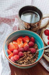 Oatmeal with cocoa, raspberries and strawberries