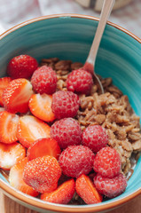 Oatmeal with cocoa, raspberries and strawberries