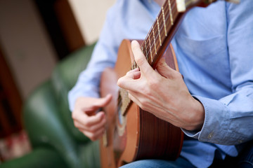 Man playing classic, acoustic guitar