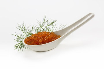 red caviar in white spoon