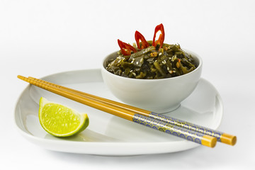 seaweed on the plate with chopsticks