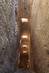 Narrow corridor in the ancient castle. Ischia island, Italy.