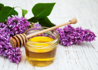 Lilac flowers with honey