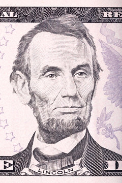Abraham Lincoln portrait from five dollars bill close-up.