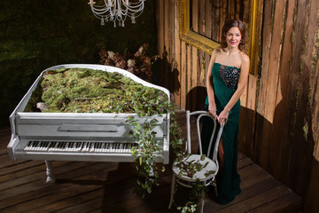 Luxury girl near piano