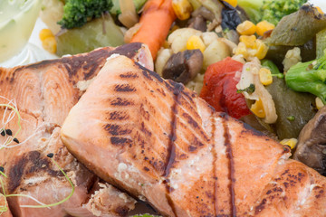 Close up of grilled salmon and vegetables