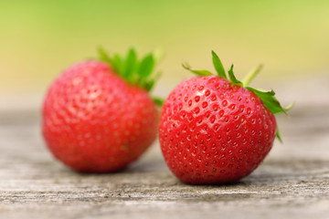 Ripe strawberries on wooden background