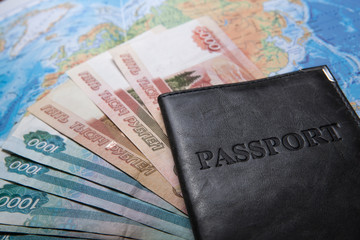 passport in the bag on a map with bank notes