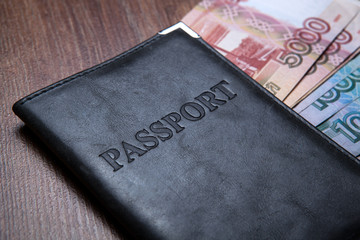 Passport on a table with paper money