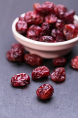 dried cranberries in a small bowl. fruit full of vitamin c..