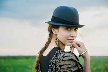 beautiful lady outdoor in hat, spring or summer season