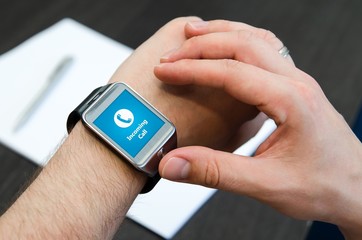 Incoming call notification on smart watch connected to smart pho