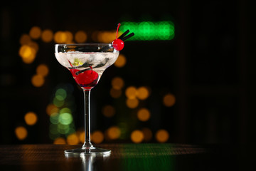 Glass of cocktails on bar background