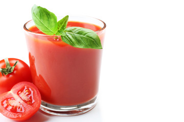 Glass of fresh tomato juice isolated on white
