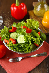 fresh vegetable salad in bowl on table close up