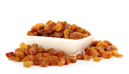 Raisins in saucer isolated on white