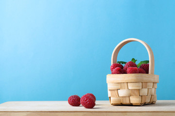 Fototapeta na wymiar Raspberry Fruit Basket on Blue Background
