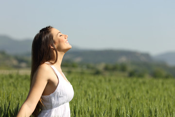 Girl breathing fresh air with white dress