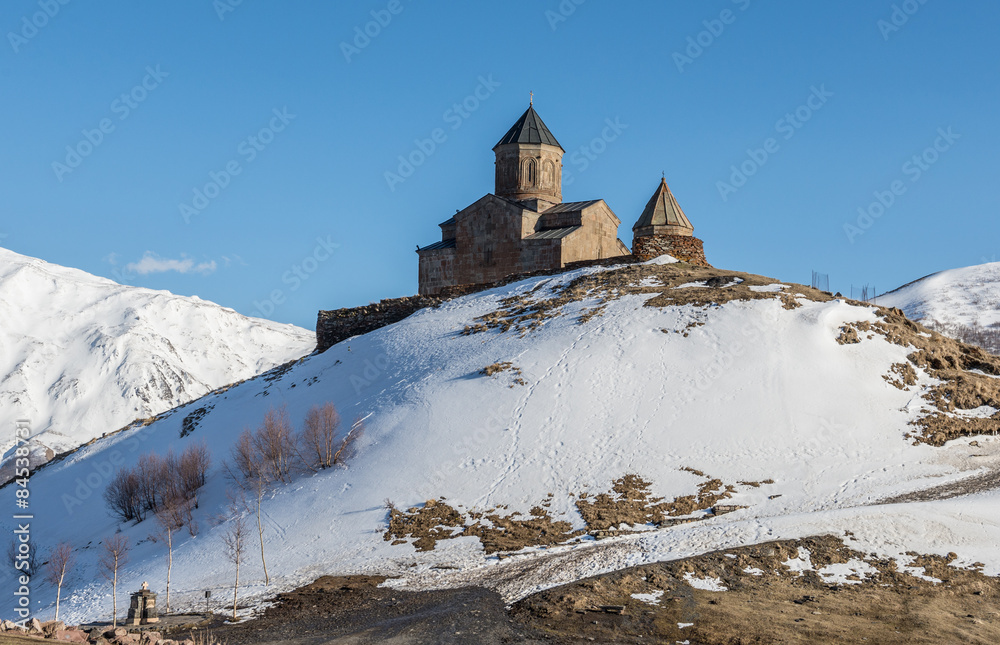 Poster 14th century Holy Trinity Church (Tsminda Sameba) near Mount Kazbek in Georgia