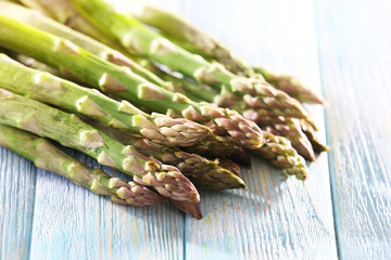 Fresh asparagus on wooden table, closeup