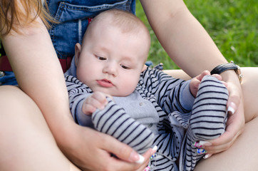 young mother playing with baby