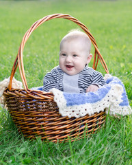 baby resting in a wicker basket