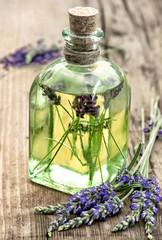 Obraz na płótnie Canvas Lavender oil with fresh flowers. Healthy herbs