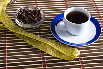 cup of coffee with the bledets filled with grains