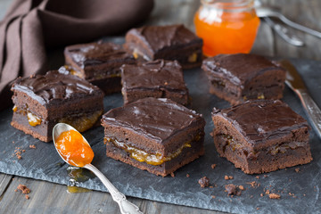 Homemade chocolate pie with apricot jam and chocolate coating