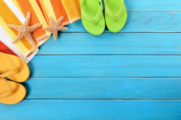 Beach background border with old blue wood deck decking and sunbathing towel summer holiday vacation photo