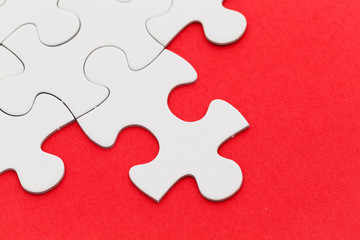 Jigsaw puzzle with missing red background