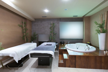 Bath and massage table in hotel spa center