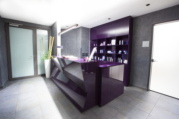 Modern counter at spa center with beauty products