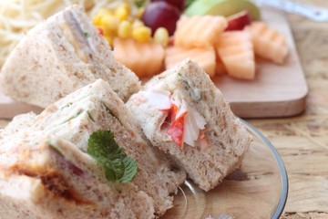 Club sandwich and pasta spaghetti with salad mix fruit