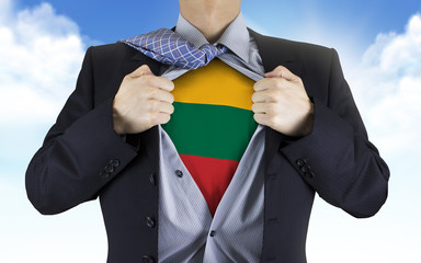 businessman showing Lithuania flag underneath his shirt
