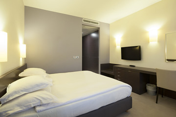 Fototapeta na wymiar Interior of a modern hotel bedroom