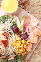 Pasta spaghetti with salad mix fruit.