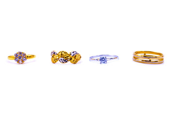 Collection of gold and silver rings over white background