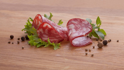 Smoked sausage on the wooden board